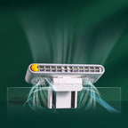 Clip fan attached to a laptop screen at a desk
