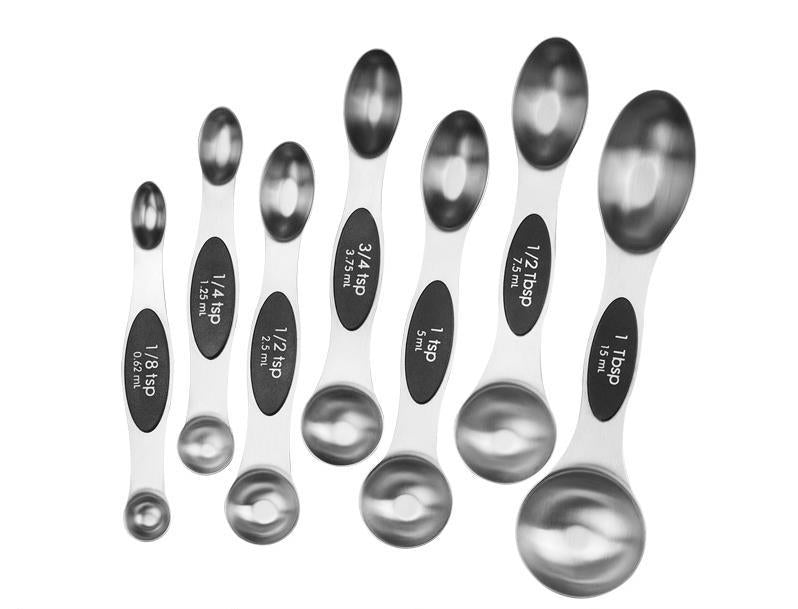 Colorful measuring spoon set laid out on a counter