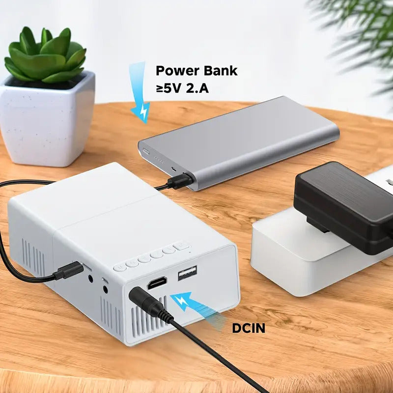 M100 mini home projector in black on entertainment stand