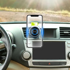 Phone charging wirelessly on car air vent mount
