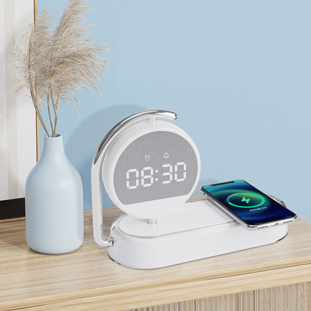 White desktop alarm clock with wireless charging pad